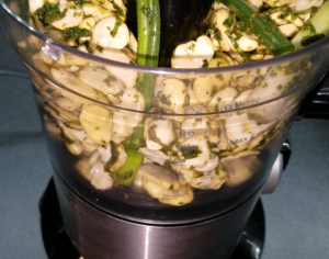 adding all ingredients for the Egyptian falafel recipe in the food processor