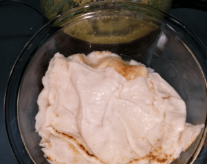 blending pita bread and spices with the Egyptian falafel mixture