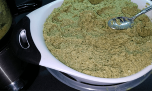 Draining homemade Egyptian falafel mixture