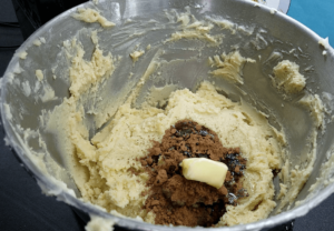 preparing smooth chocolate dough for Egyptian betefour cookies recipe