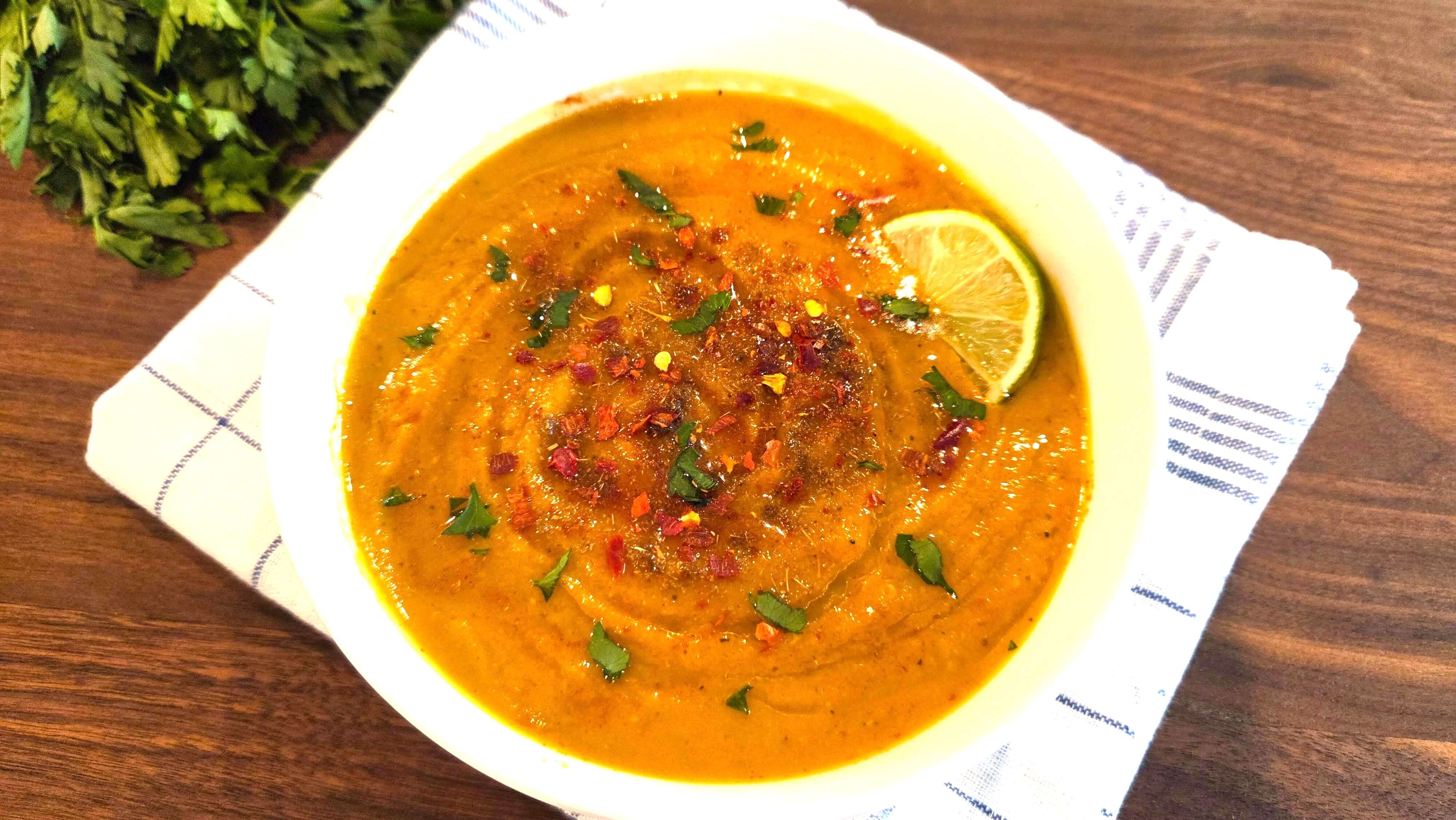 Serve your lentil soup hot with parsley.