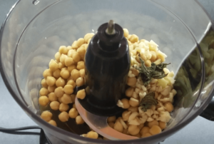 Ingredients for an easy Mediterranean hummus recipe, including chickpeas, garlic, lemon, and olive oil