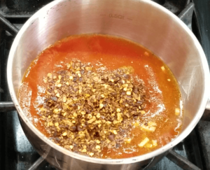 Preparing hot sauce for Egyptian koshari