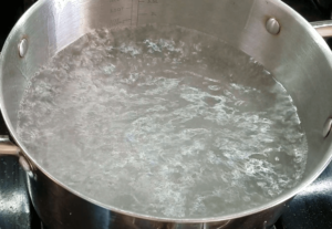 Boiling water to cook pasta for the koshari recipe