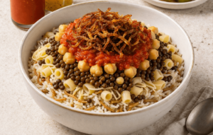 Layering rice, lentils, pasta, and chickpeas to assemble Egyptian koshari