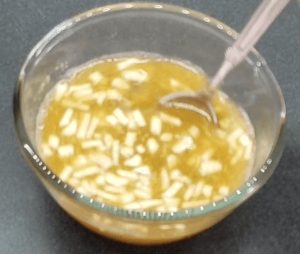 Preparing garlic vinegar sauce for Egyptian koshari