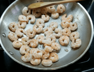 Shrimp cooking in butter sauce for shrimp scampi pasta