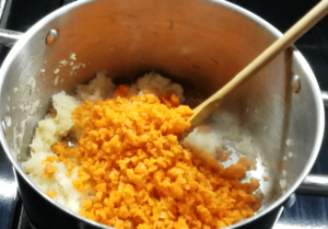 Added minced garlic and carrots to the onions for the Egyptian red lentil soup