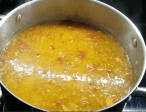 Simmering the red lentil soup