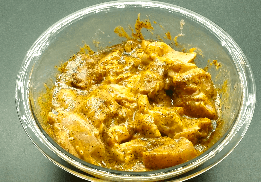 Chicken pieces coated in a creamy yogurt and spice marinade for juicy Middle Eastern chicken kebabs.