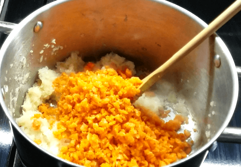 Stirring onion and carrots.