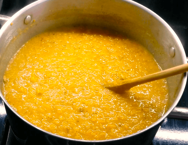 Stirring lentil soup.