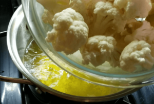 Fresh cauliflower florets cut into bite size pieces for vegan crispy cauliflower recipe