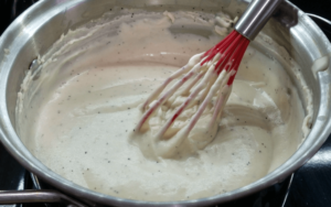 Whisking bechamel sauce