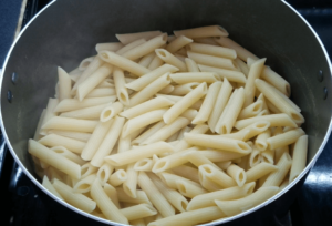 Cooked Penne pasta in a pot
