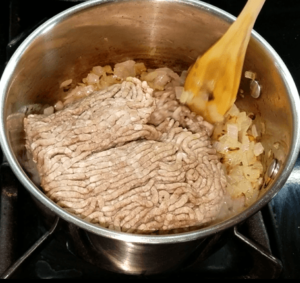 Raw ground beef in a pan