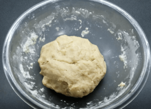 A dough in a bowl.