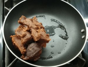 Date paste and oil in a pan