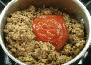 Tomato Sauce on top of the ground beef