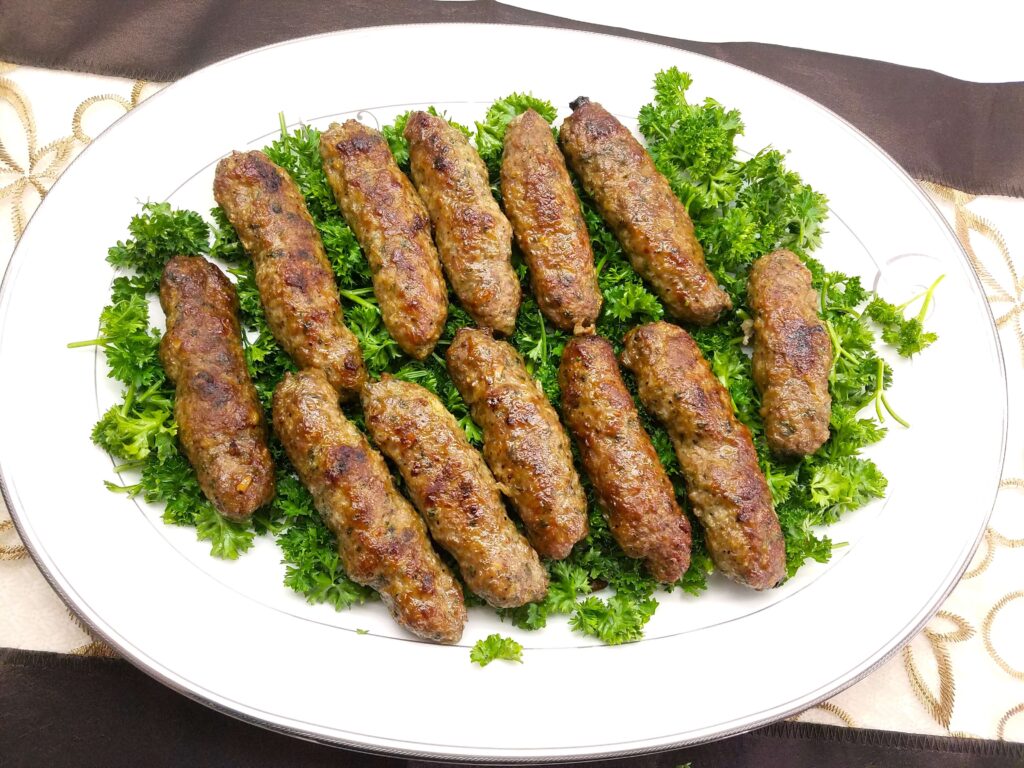 Egyptian Kofta Kebab platter served on a bed of fresh parsley.