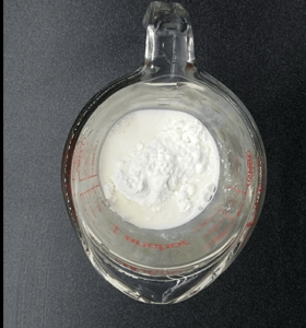 milk and cornstarch in a cup