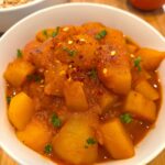 Vegan Egyptian potato stew (batates) in tomato sauce with onions and herbs, authentic easy one-pot recipe