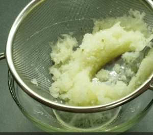 press with a spoon the onion pulp through a fine-mesh strainer