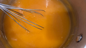 Cooking qamar al din pudding mixture in saucepan until thickened
