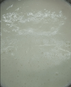 milk in the rice pudding boiling
