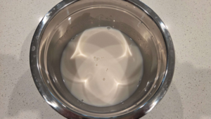 Yeast mixed with warm milk water and sugar for Turkish flatbread dough
