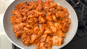 Mediterranean spicy honey garlic chicken bites in a skillet