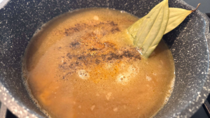 Cardamom and bay leaves added to Egyptian bird tongue soup while simmering