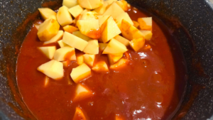 Cubed potatoes added to Egyptian Bazella recipe