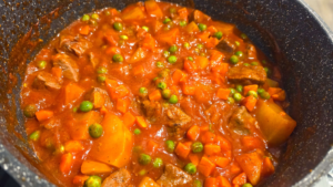 Egyptian Bazella stew cooking until vegetables are tender