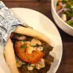 Easy doner kebab recipe served in warm Turkish flatbread with salad and tahini sauce