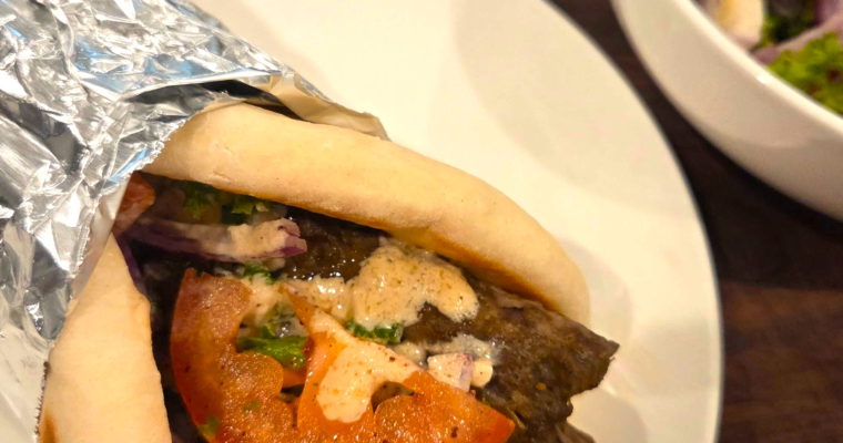 Easy doner kebab recipe served in warm Turkish flatbread with salad and tahini sauce
