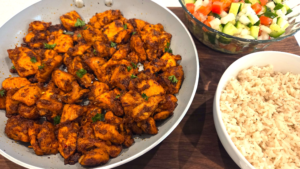 Easy Mediterranean spicy honey garlic chicken bites dinner served with rice and fresh salad