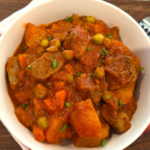 Egyptian Bazella recipe with beef peas carrots and potatoes in tomato sauce