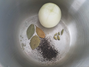 Preparing to cook chicken to make Egyptian chicken noodle soup base