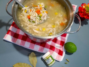 simmering chicken noodle soup with vegetables and pasta in one pot