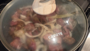 Kabab halla simmering in a pot with beef and onions forming a rich sauce