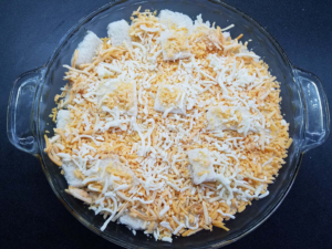 layering bread and cheese for Egyptian eggah