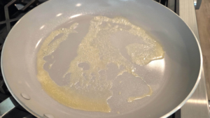 Melting butter in a skillet for Honey garlic chicken