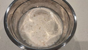 Flour added to the yeast mixture for Turkish flatbread recipe