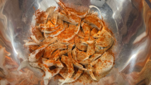 Mixing yogurt marinade with Middle Eastern spices for grilled chicken thighs.