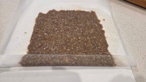 Homemade doner kebab meat rolled into a log using parchment paper