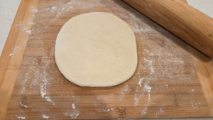 Rolling bazlama dough into round Turkish flatbreads