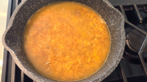 Shorbet Lesan El Asfour soup simmering until the orzo becomes tender and creamy