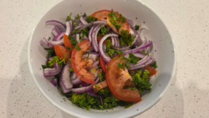 Fresh Turkish salad with onions, tomatoes, parsley, and sumac for doner kebab