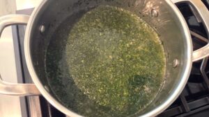 Molokhia simmering in broth
